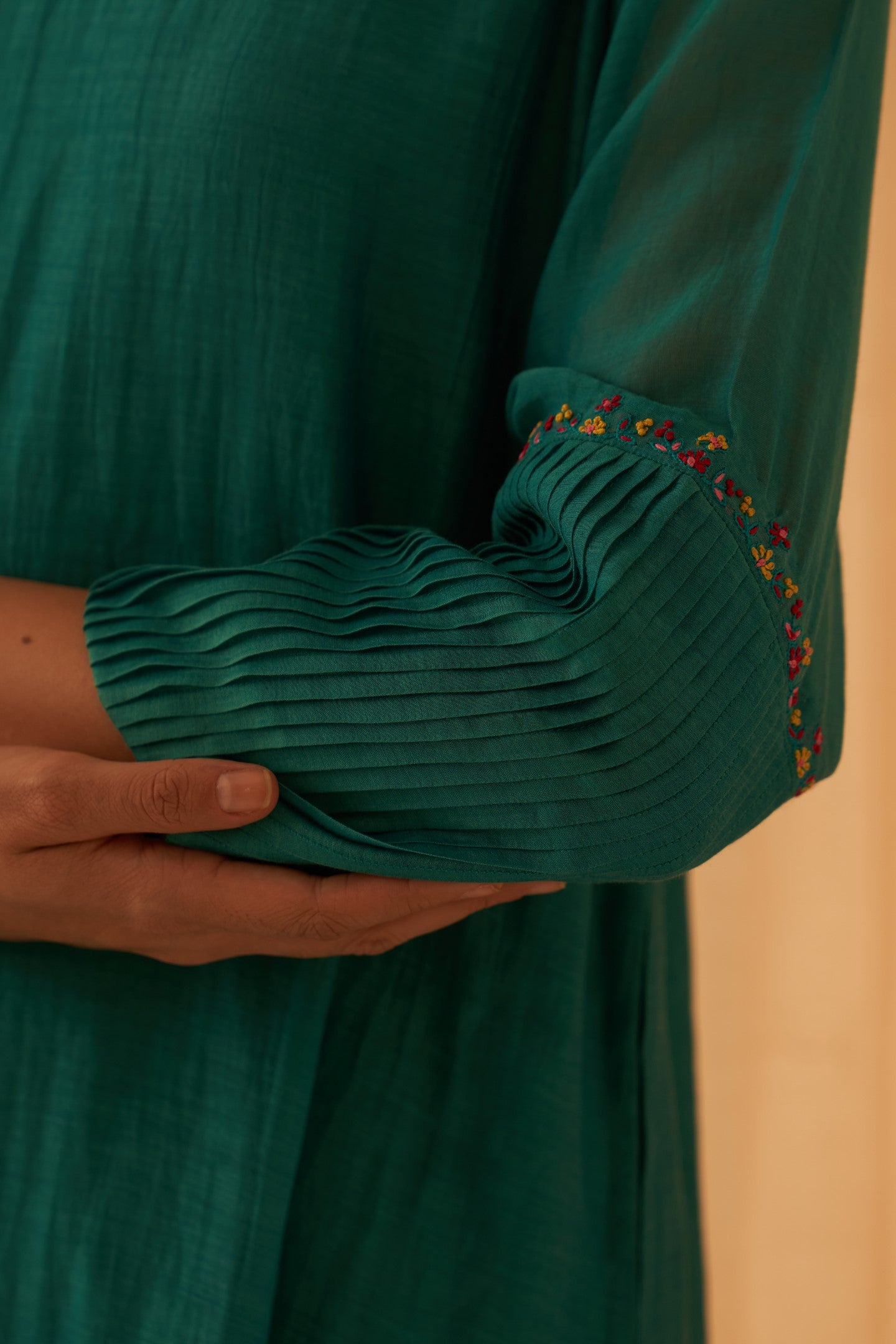 Turquoise chanderi kurta with pintuck box pleats and floral work on sleeves  paired with pant & organza dupatta