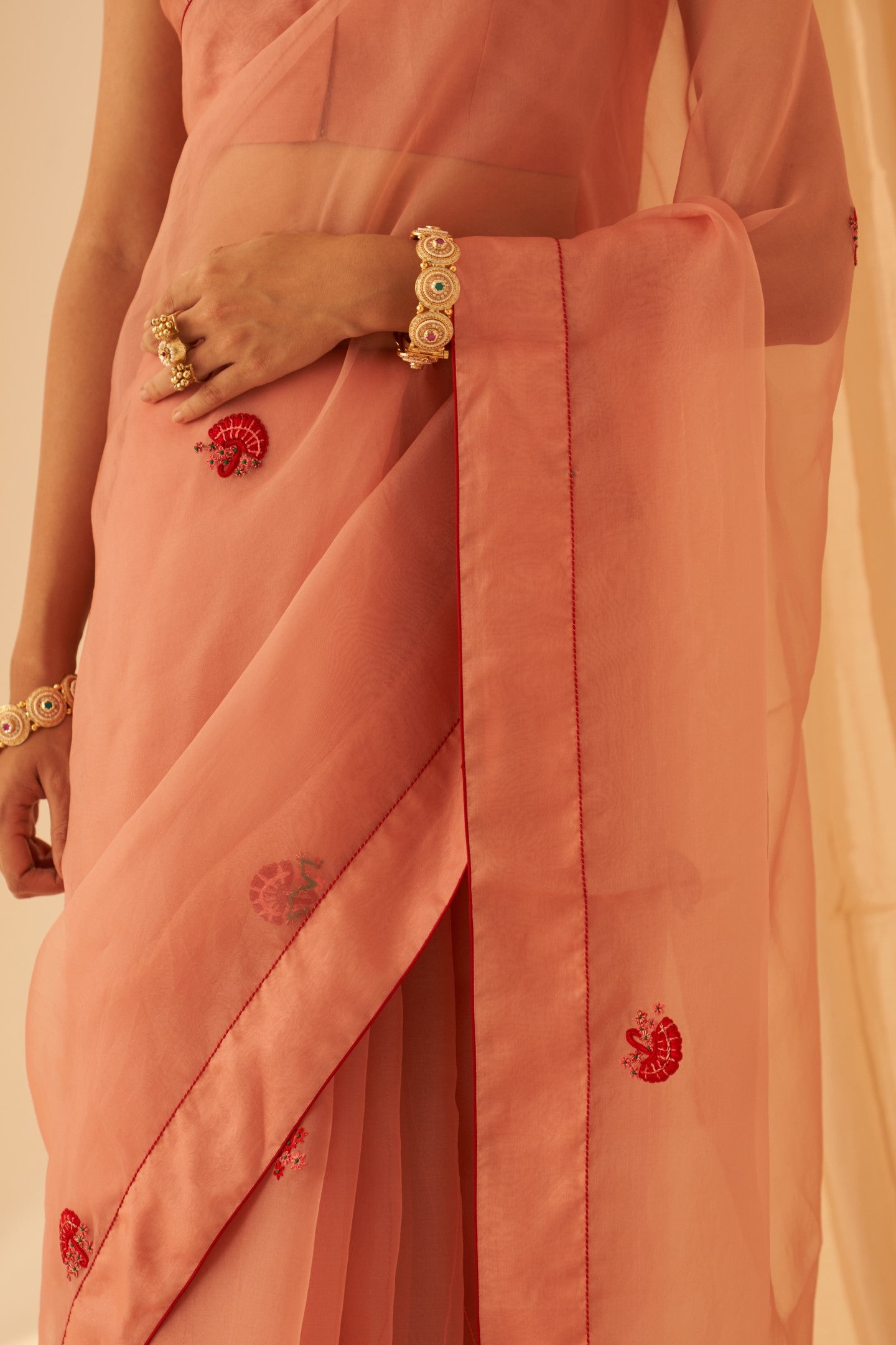 Peach organza thread zardozi hand embroidered saree paired with an organic cotton stitched petticoat