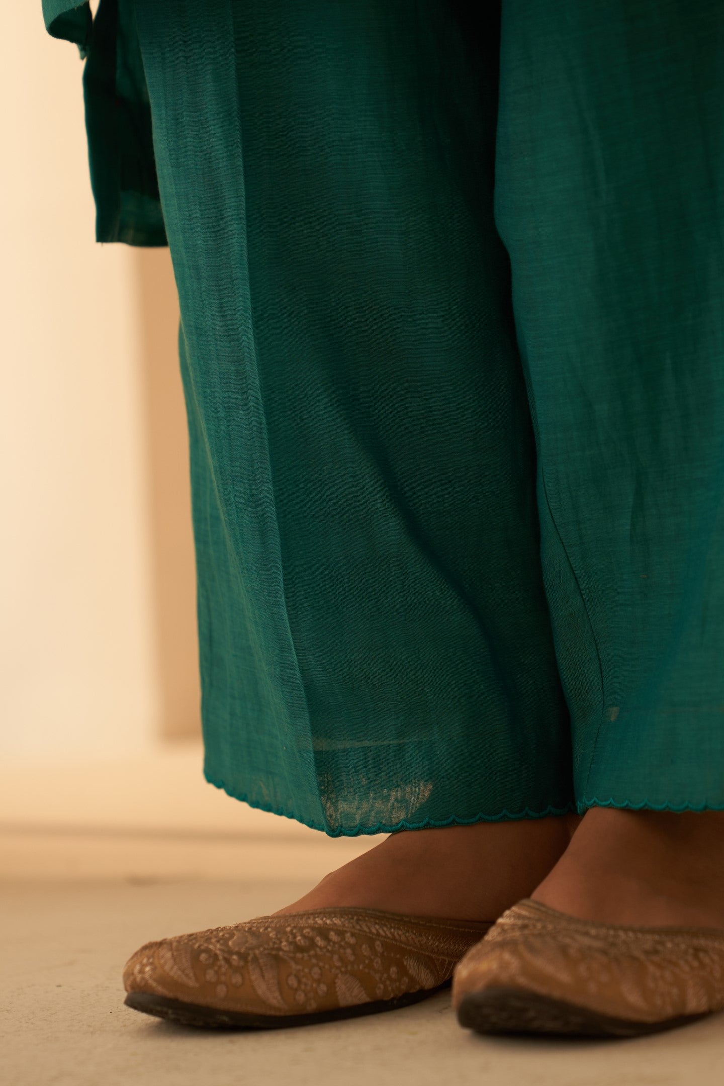 Turquoise chanderi kurta with pintuck box pleats and floral work on sleeves  paired with pant & organza dupatta