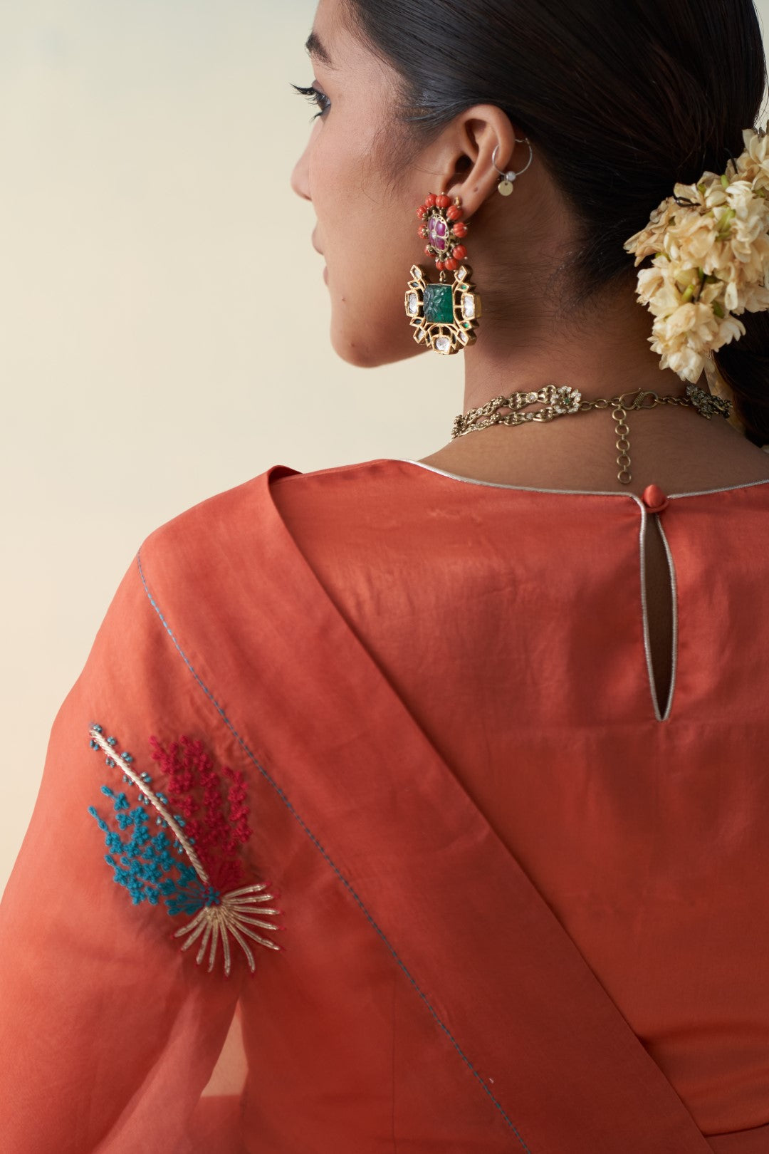 Rust organza motifs embroidered saree comes with an organic cotton stitched petticoat (02 Pcs.)