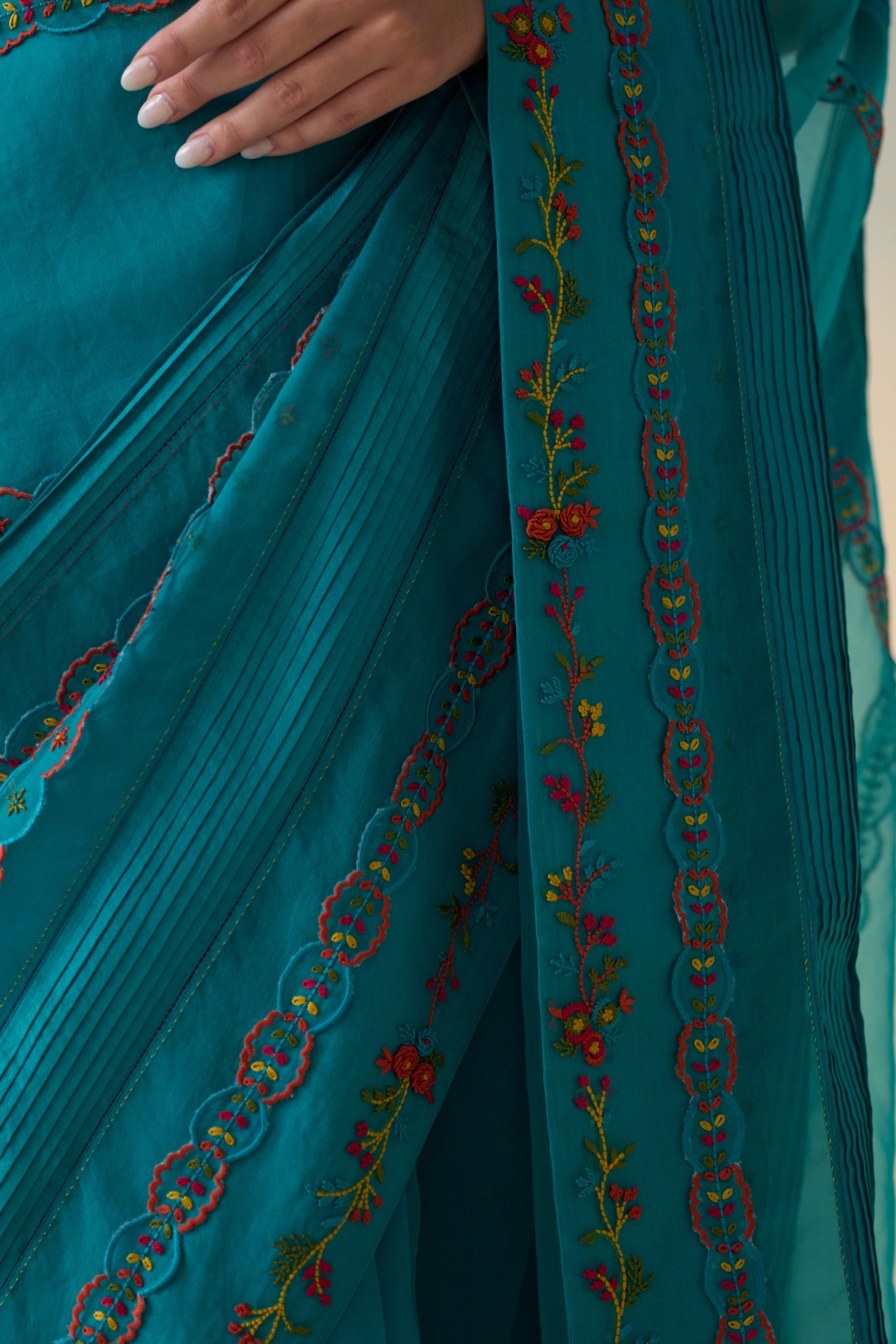 Turquoise silk multicolor embroidered & scallop work saree comes with an organic cotton stitched petticoat ( 02 Pcs.)