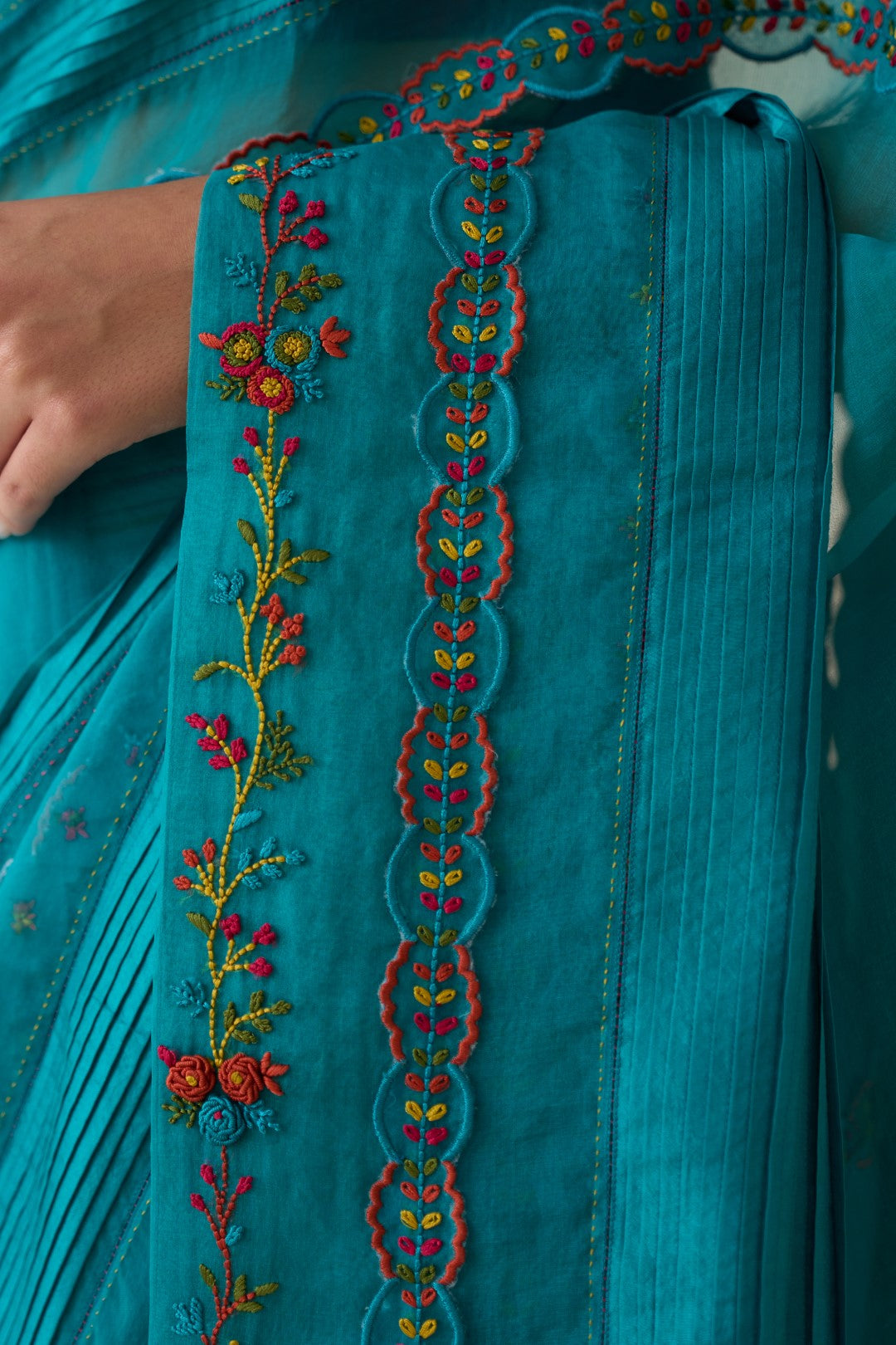 Turquoise silk multicolor embroidered & scallop work saree comes with an organic cotton stitched petticoat ( 02 Pcs.)