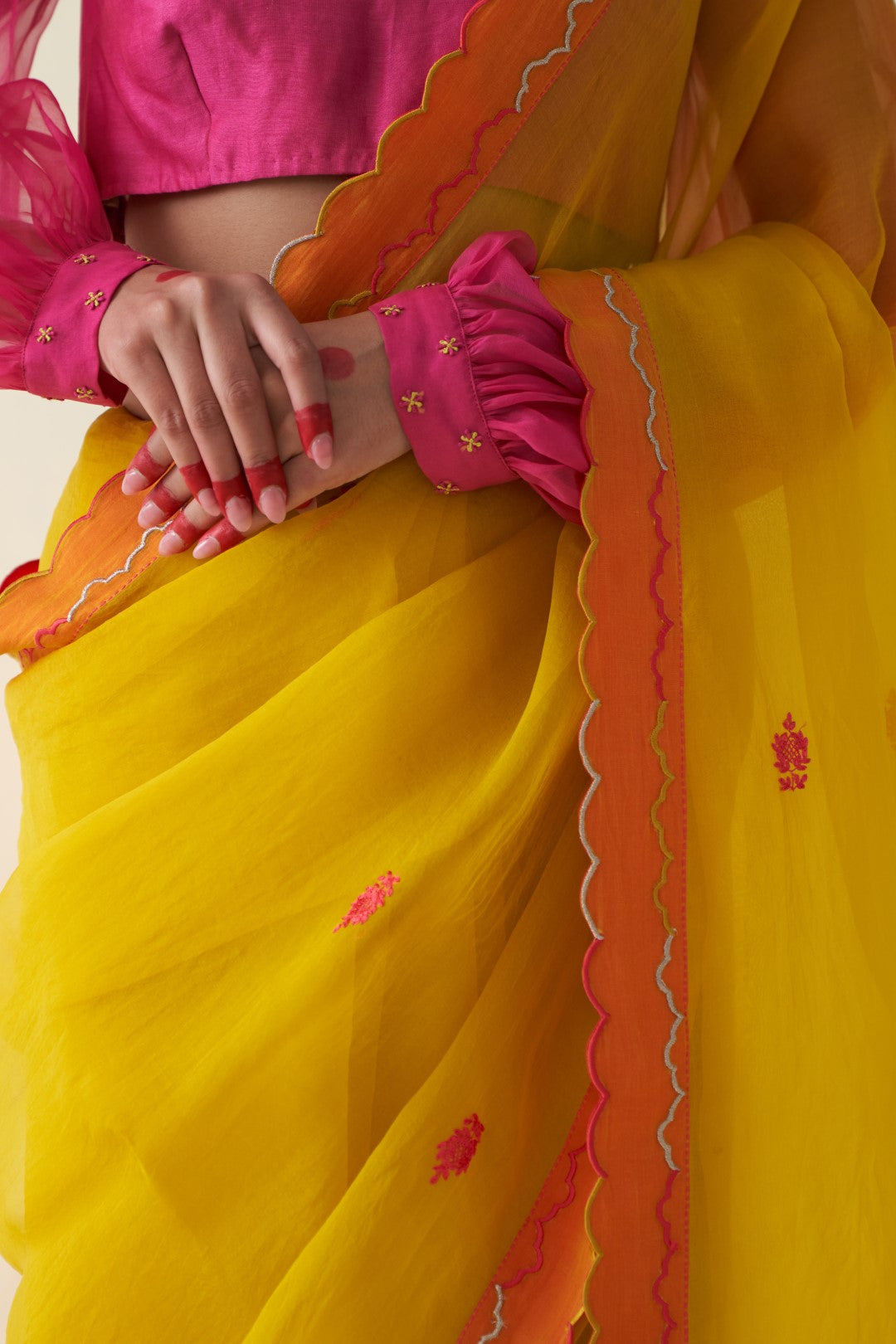 Yellow organza embroidered  scallop border saree comes with an organic cotton stitched petticoat (02 Pcs.)