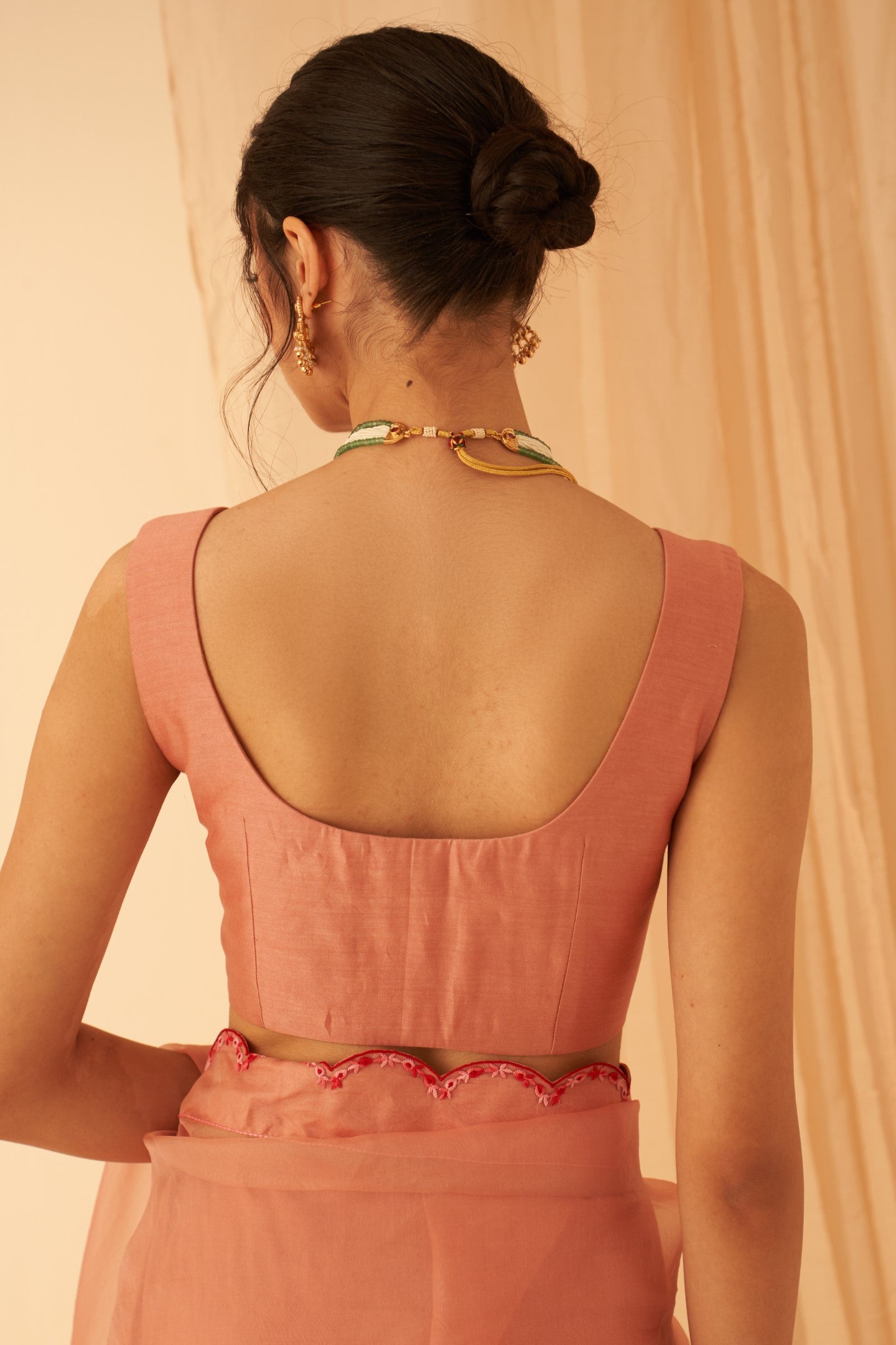 Peach silk sleeveless blouse