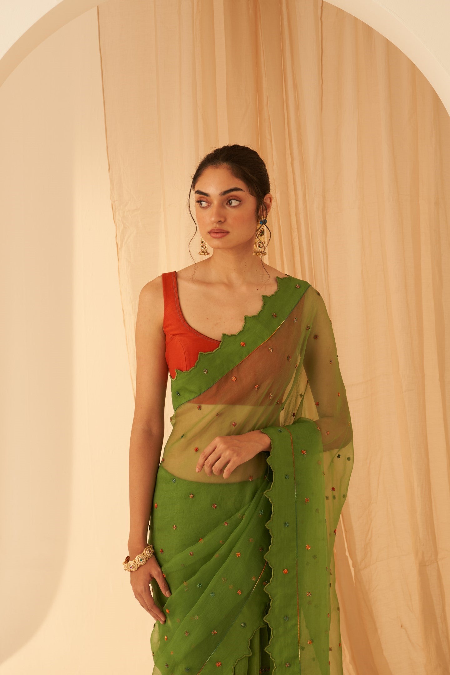 Green Chanderi-organza  embroidered with cross taanka work, scalloped border saree paired with an organic cotton stitched petticoat