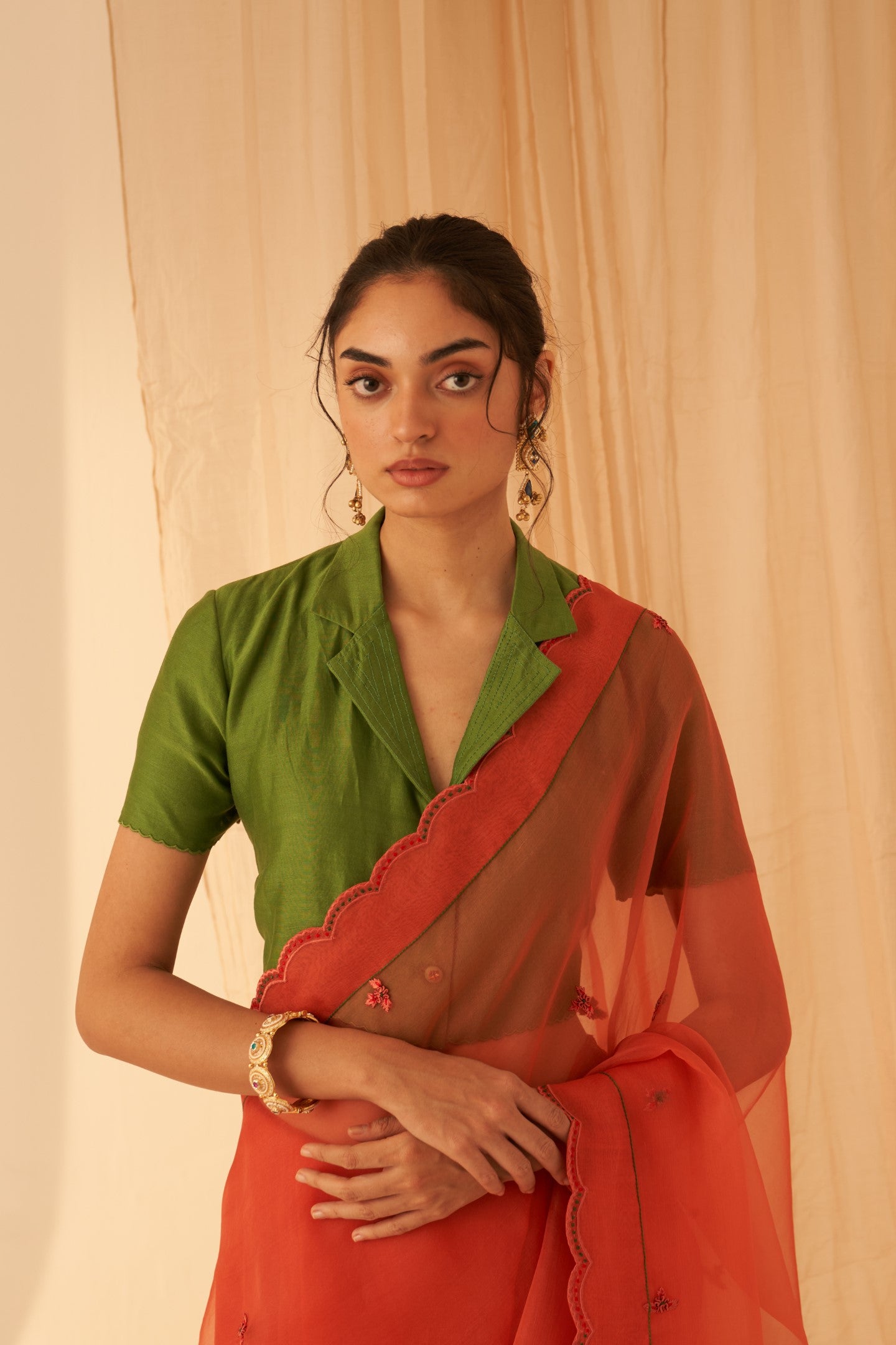 Rust organza allover embroidered butis with beautiful scallop border saree paired with an organic cotton stitched petticoat